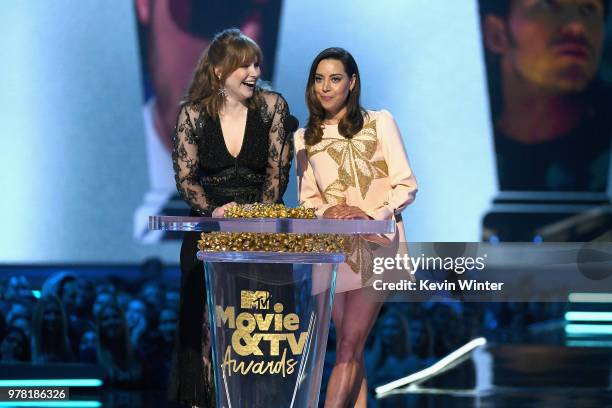 Actors Bryce Dallas Howard and Aubrey Plaza speak onstage during the 2018 MTV Movie And TV Awards at Barker Hangar on June 16, 2018 in Santa Monica,...