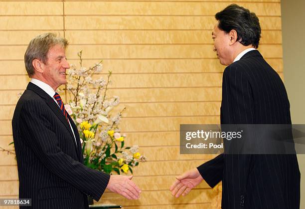 French foreign minister Bernard Kouchner is welcomed by Japanese Prime Minister Yukio Hatoyama prior to their talks at Hatoyama's official residence...