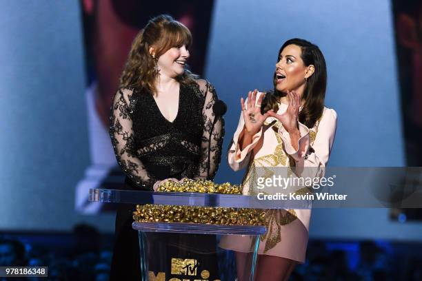 Actors Bryce Dallas Howard and Aubrey Plaza walk onstage during the 2018 MTV Movie And TV Awards at Barker Hangar on June 16, 2018 in Santa Monica,...
