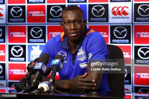 Majak Daw of the Kangaroos speaks to the media during an AFL press conference at Etihad Stadium on June 19, 2018 in Melbourne, Australia.