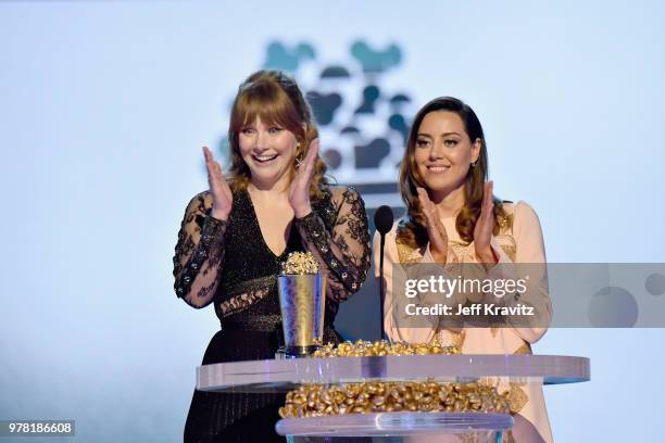 Bryce Dallas Howard and Aubrey Plaza speak onstage at the 2018 MTV Movie And TV Awards at Barker Hangar on June 16, 2018 in Santa Monica, California.