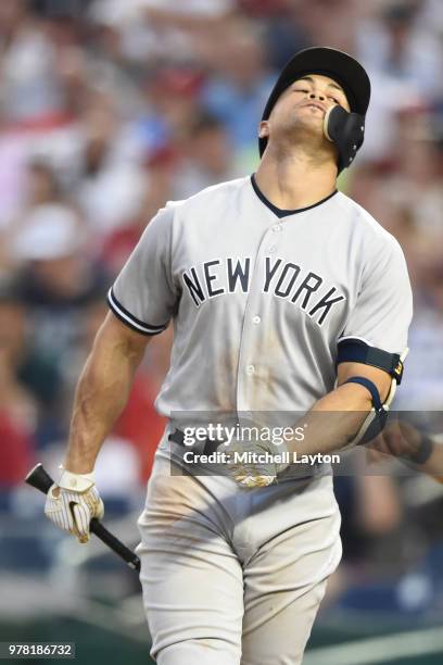 Giancarlo Stanton of the New York Yankees reacts after striking out in the six inning during game two of a double header against the Washington...