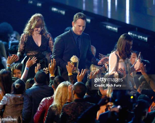 Actor Chris Pratt walks offstage after accepting the MTV Generation Award with actors Bryce Dallas Howard and Aubrey Plaza during the 2018 MTV Movie...