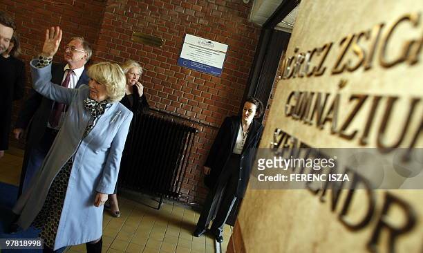 Camilla, wife of Britain's Prince Charles waves to students during her visit to the 'Moricz Zsigmond' Secondary School in Szentendre on March 17,...