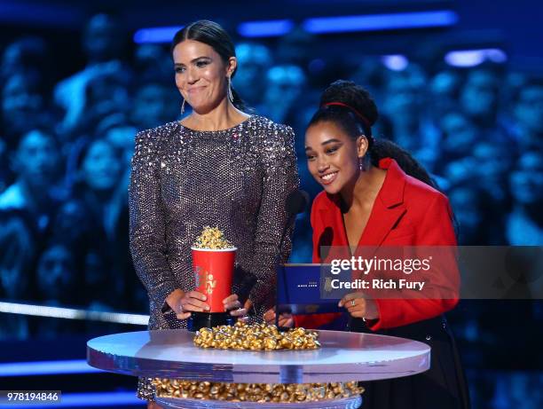 Actors Mandy Moore and Amandla Stenberg speak onstage during the 2018 MTV Movie And TV Awards at Barker Hangar on June 16, 2018 in Santa Monica,...