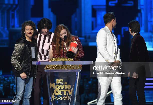 Actors Gaten Matarazzo, Finn Wolfhard, Sadie Sink, Dacre Montgomery, and Noah Schnapp accept the Best Show award for 'Stranger Things' onstage during...