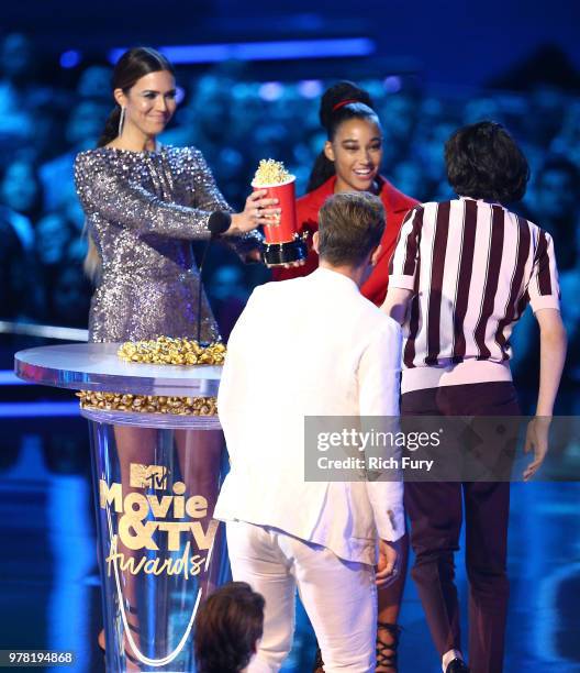 Actors Dacre Montgomery and Finn Wolfhard accept Best Show for 'Stranger Things' from actors Mandy Moore and Amandla Stenberg onstage during the 2018...