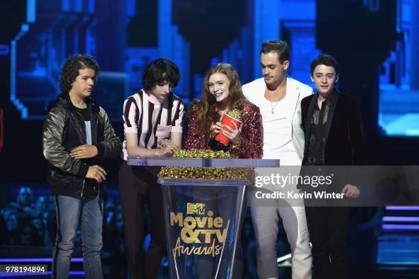 Actors Gaten Matarazzo, Finn Wolfhard, Sadie Sink, Dacre Montgomery, and Noah Schnapp accept the Best Show award for 'Stranger Things' onstage during...