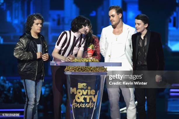 Actors Gaten Matarazzo, Finn Wolfhard, Sadie Sink, Dacre Montgomery, and Noah Schnapp accept the Best Show award for 'Stranger Things' onstage during...