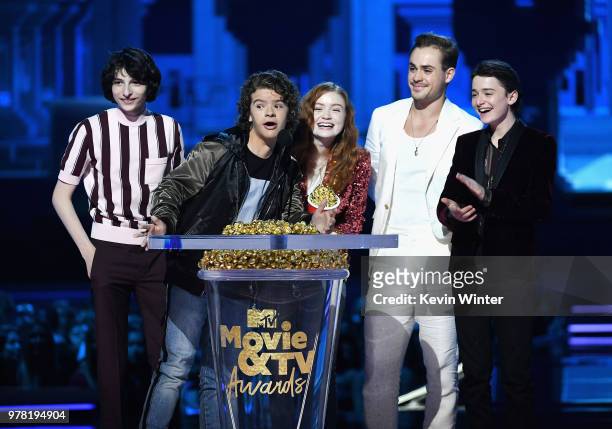 Actors Finn Wolfhard, Gaten Matarazzo, Sadie Sink, Dacre Montgomery, and Noah Schnapp accept the Best Show award for 'Stranger Things' onstage during...