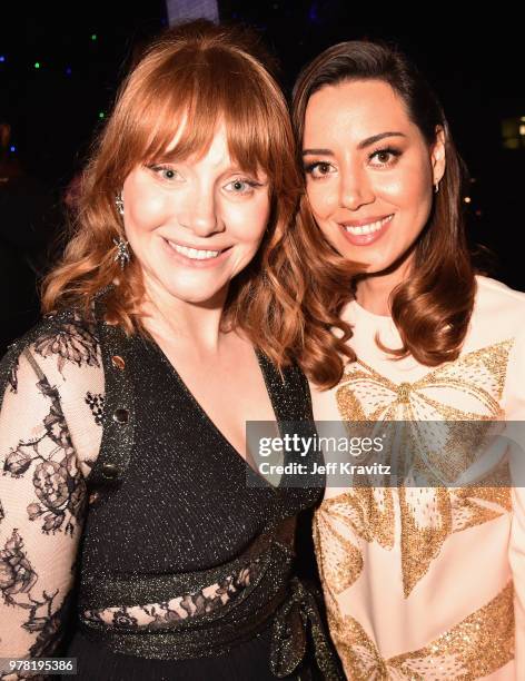 Actors Bryce Dallas Howard and Aubrey Plaza attend the 2018 MTV Movie And TV Awards at Barker Hangar on June 16, 2018 in Santa Monica, California.