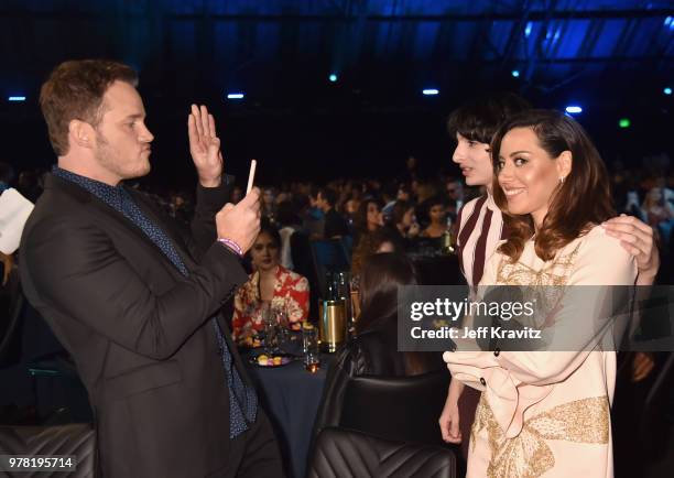 Actors Chris Patt, Finn Wolfhard, and Aubrey Plaza attend the 2018 MTV Movie And TV Awards at Barker Hangar on June 16, 2018 in Santa Monica,...