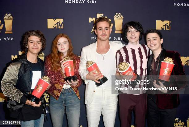 Gaten Matarazzo, Sadie Sink, Dacre Montgomery, Finn Wolfhard and Noah Schnapp pose with the Best Show award for 'Stranger Things' during the 2018 MTV...