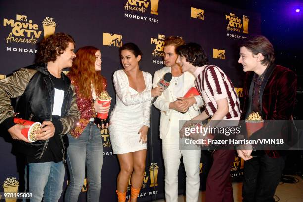 Gaten Matarazzo, Sadie Sink, Dacre Montgomery, Finn Wolfhard and Noah Schnapp, winners of Best Show for 'Stranger Things', attend the 2018 MTV Movie...