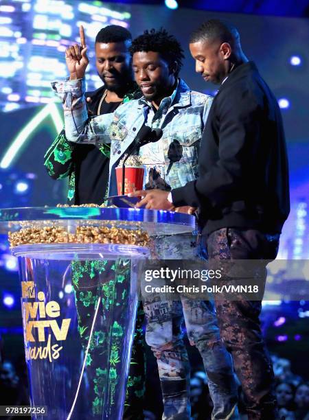 Actors Winston Duke, Chadwick Boseman, and Michael B. Jordan accept the Best Movie award for 'Black Panther' onstage during the 2018 MTV Movie And TV...