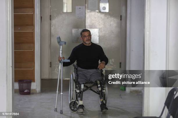 Palestinian man with prosthetic legs on a wheelchair pictured at Gaza's Artificial Limbs and Polio Centre , in Gaza City, 22 April 2018. The ALPC was...