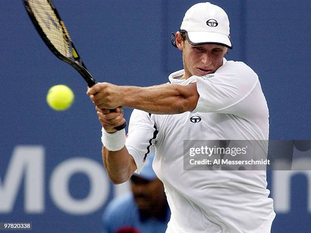 David Nalbandian of Argentina follows through on a backhand Thursday, September 4, 2003 at the U. S. Open in New York. Federer, the second seed from...