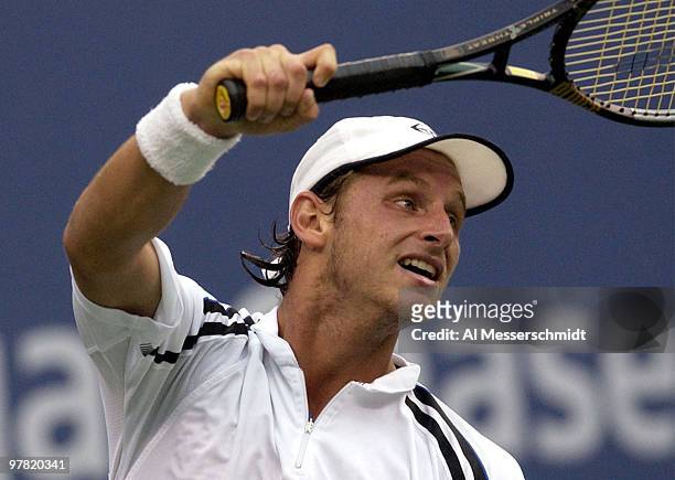 David Nalbandian of Argentina follows through on a forehand Thursday, September 4, 2003 at the U. S. Open in New York. Federer, the second seed from...