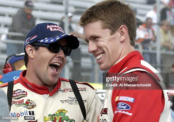 Brendan Gaughan enjoys a moment with pole sitter Carl Edwards Saturday, October 18, 2003 during the NASCAR Craftsman Truck Series Advance Auto Parts...