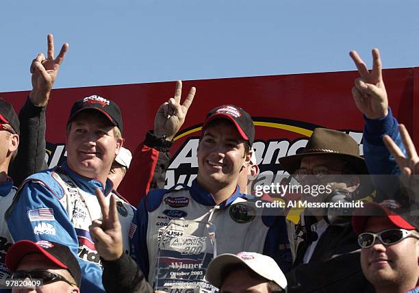 Crew chief John Monsam , driver Jon Wood and owner Jack Roush celebrate victory Saturday, October 18, 2003 during the NASCAR Craftsman Truck Series...