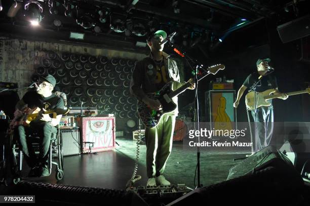 Eric Howk, John Gourley and Zachary Carothers of Portugal. The Man perform onstage during the Grand Re-Opening of Asbury Lanes at Asbury Lanes on...