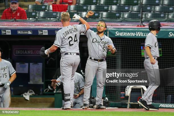 Chicago White Sox designated hitter Matt Davidson is congratulated bu Chicago White Sox infielder Yolmer Sanchez after hitting a home run during the...