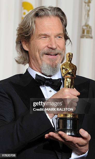 Actor Jeff Bridges celebrates his Oscar for best actor for his portrayal of an alcoholic country singer in the drama "Crazy Heart" during the 82nd...