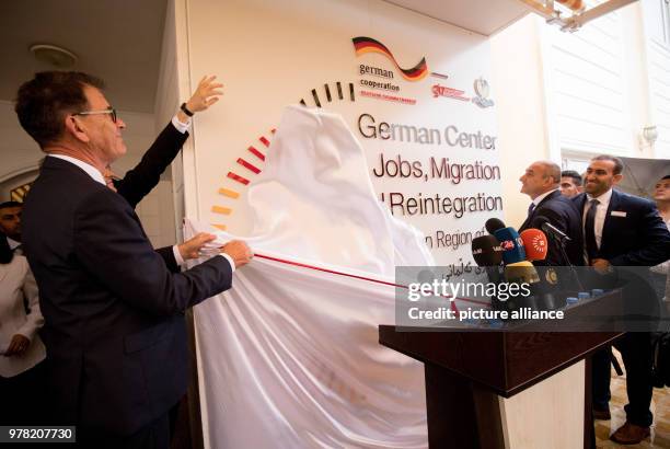 German Development Minister, Gerd Mueller opens a migration advisory center, with Iraqi Minister of Planning Ali Sindi, in Baghdad, Iraq, 22 April...
