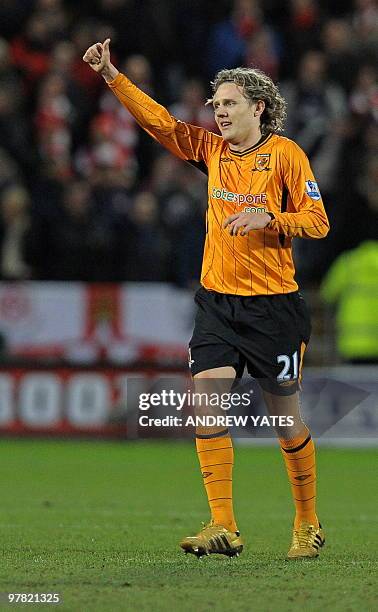 Hull City's English midfielder Jimmy Bullard celebrates after scoring during the English Premier League football match between Hull City and Arsenal...