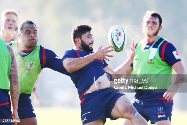 Colby Fainga'a is tackled by Sam Talakai during a Melbourne Rebels Super Rugby training session at Gosch's Paddock on June 19, 2018 in Melbourne,...