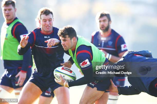 Tom English of the Rebels is tackled during a Melbourne Rebels Super Rugby training session at Gosch's Paddock on June 19, 2018 in Melbourne,...