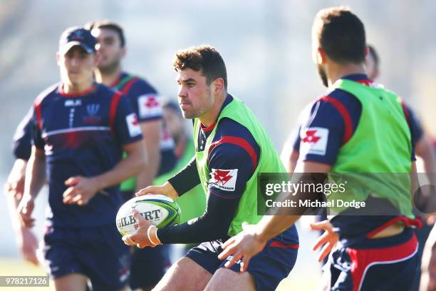 Tom English of the Rebels runs with the ball during a Melbourne Rebels Super Rugby training session at Gosch's Paddock on June 19, 2018 in Melbourne,...