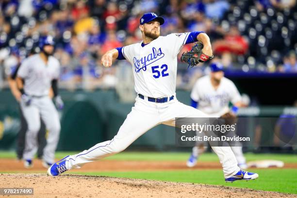 Justin Grimm of the Kansas City Royals pitches against the Texas Rangers during the ninth inning at Kauffman Stadium on June 18, 2018 in Kansas City,...