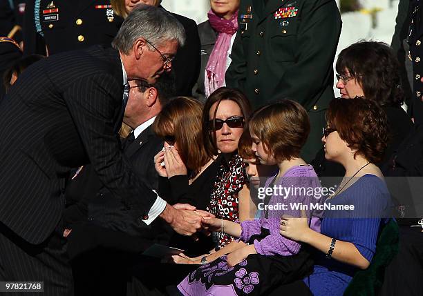 Secretary of the Army John McHugh greets family and friends, including Emalyn Windorski, attending a group burial service for four U.S. Soldiers who...