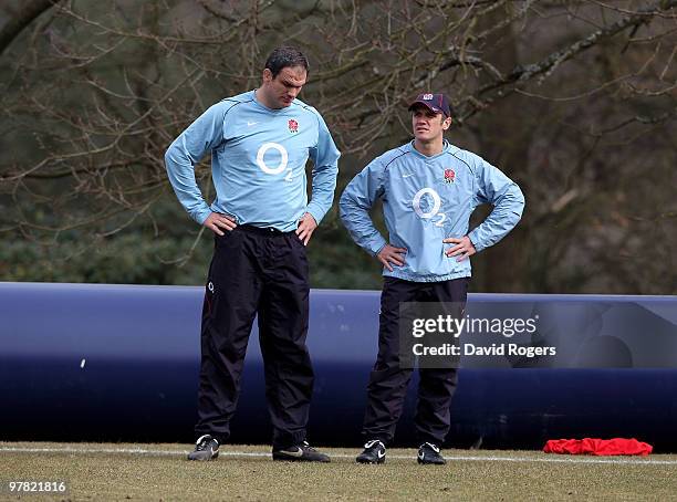 Martin Johnson, the England head coach talks to Brian Smith, the England backs coach during the England training session held at Pennyhill Park on...