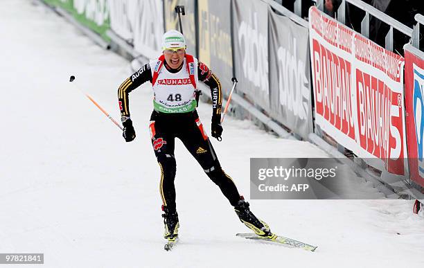 German Simone Hauswald, skisto win the 7,5 km sprint distance for women in the Holmenkollen WC biathlon event in Oslo on March 18, 2010. AFP Photo:...