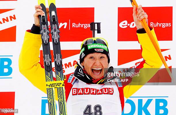 Simone Hauswald of Germany celebrates her gold medal on the podium after the 7,5 km sprint distance for women in the Holmenkollen WC biathlon event...
