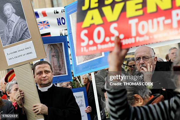 Anti-abortion demonstrators protest on March 18, 2010 in front of the Institute of France in Paris during the welcoming reception of French former...