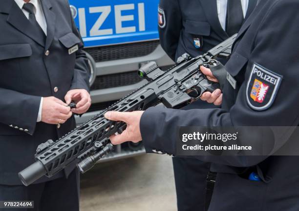 Police officer holds the new multicaliber type MCX assault rifle of the manufacturer Sig Sauer in Kiel, Germany, 23 April 2018. Schleswig-Holstein's...