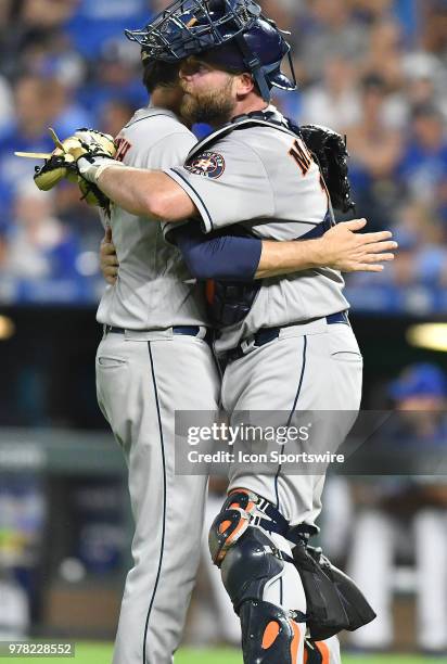 Houston Astros catcher Brian McCann bear hugs Houston Astros relief pitcher Collin McHugh after winning a Major League Baseball game between the...