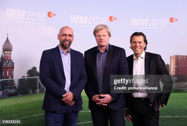 April 2018, Germany, Hamburg: Holger Stanislawski , Oliver Kahn and Urs Meier, ZDF presenters for the soccer World Cup 2018 in Russia, during a...