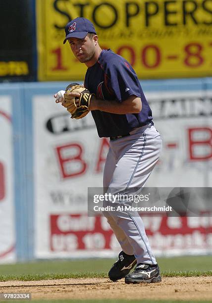 Cleveland Indians shortstop John McDonald fields a ball against the Toronto Blue Jays in Dunedin, Florida, March 23, 2004.