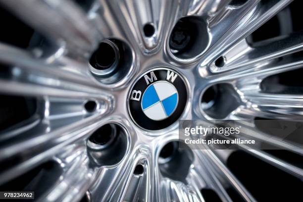 April 2018, Munich, Germany: The BMW logo is to be seen on the rim of a car. Photo: Sven Hoppe/dpa