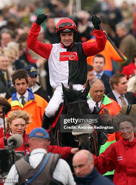Ruby Walsh celebrates after riding Big Buck's to victory in the Ladbrokes World Hurdle on Day Three of the Cheltenham Festival on March 18, 2010 in...