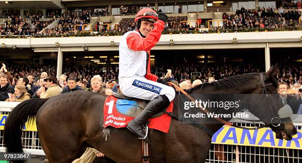 Ruby Walsh celebrates ridding Big Buck's to victory in The Ladbrokes World Hurlde Race during Ladies Day of the Cheltenham Festival on March 18, 2010...