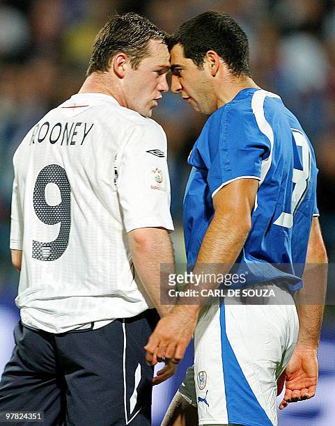 England's Wayne Rooney clashes with Israel's Tal Ben Haim , resulting in a yellow card given to both players during their European Championships 2008...
