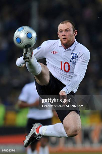 Wayne Rooney of England kicks a ball during the WC2010 Group 6 qualifying football match against Ukraine in Dnipropetrovsk on October 10, 2009. AFP...