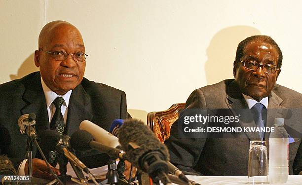 South African President Jacob Zuma and President Robert Mugabe give a press conference after meeting with Zimbabwean political leaders at Rainbow...