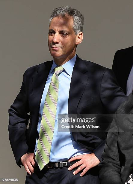 White House Chief of Staff Rahm Emanuel listens to U.S. President Barack Obama speak before he signed the Hire Act during a ceremony in the Rose...