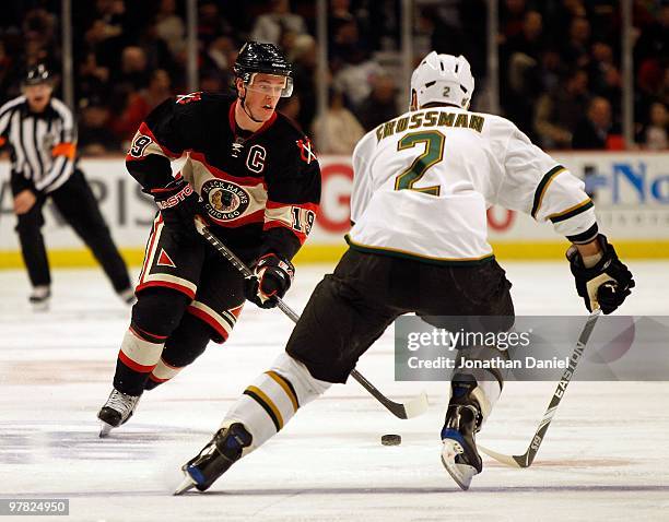 Jonathan Toews of the Chicago Blackhawks skates up the ice against Nicklas Grossman of the Dallas Stars at the United Center on February 9, 2010 in...